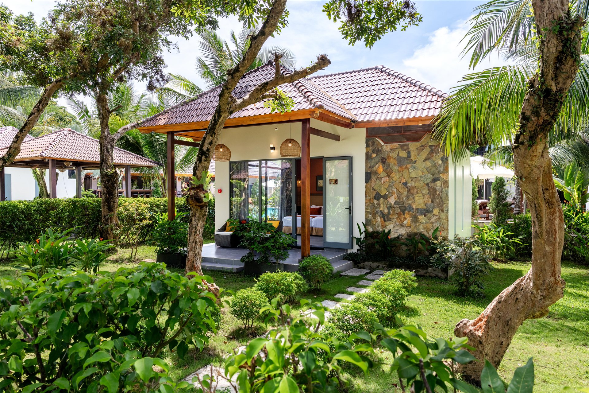 A garden path leading to the resort’s tropical bungalows