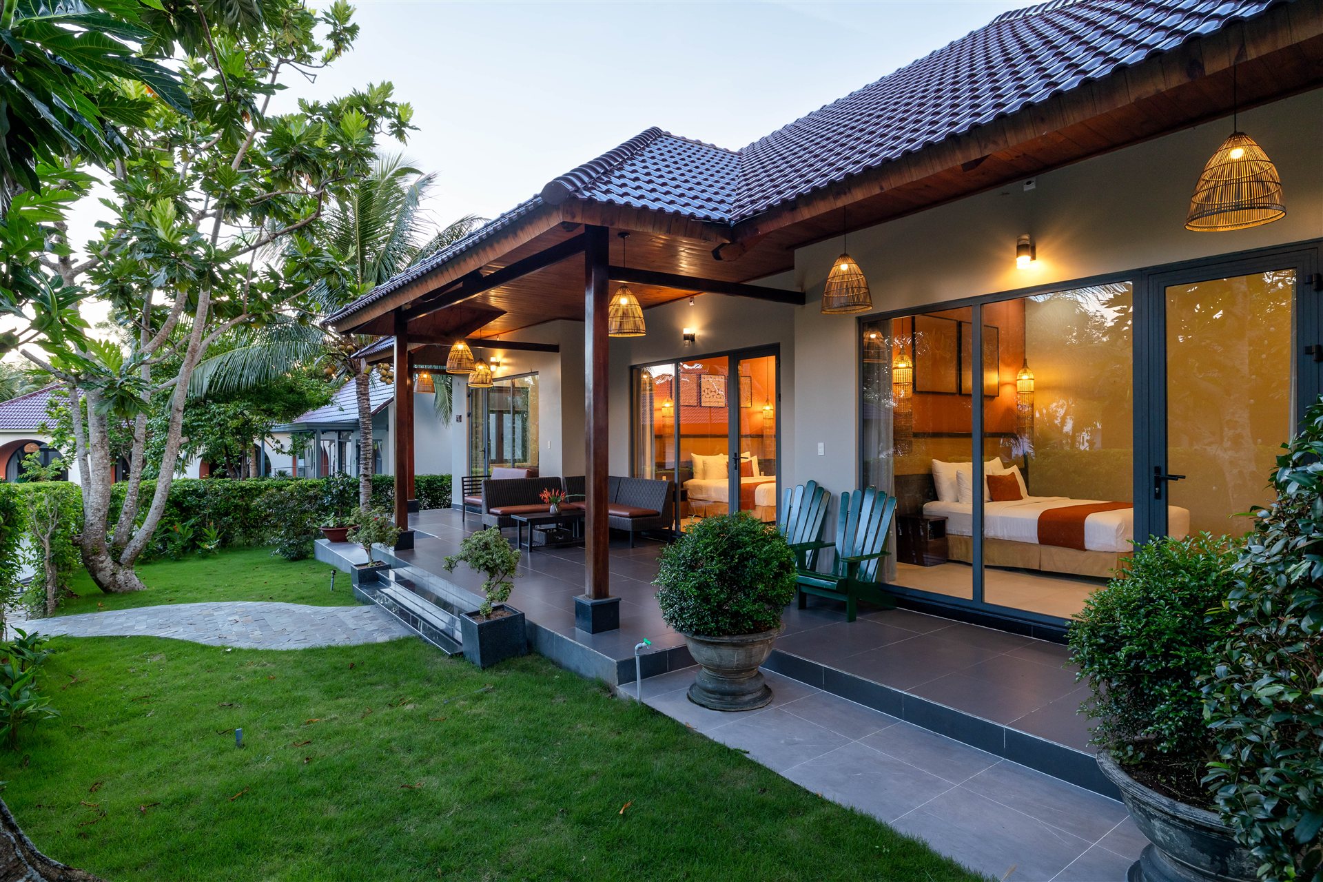 A villa terrace opening onto the tropical garden